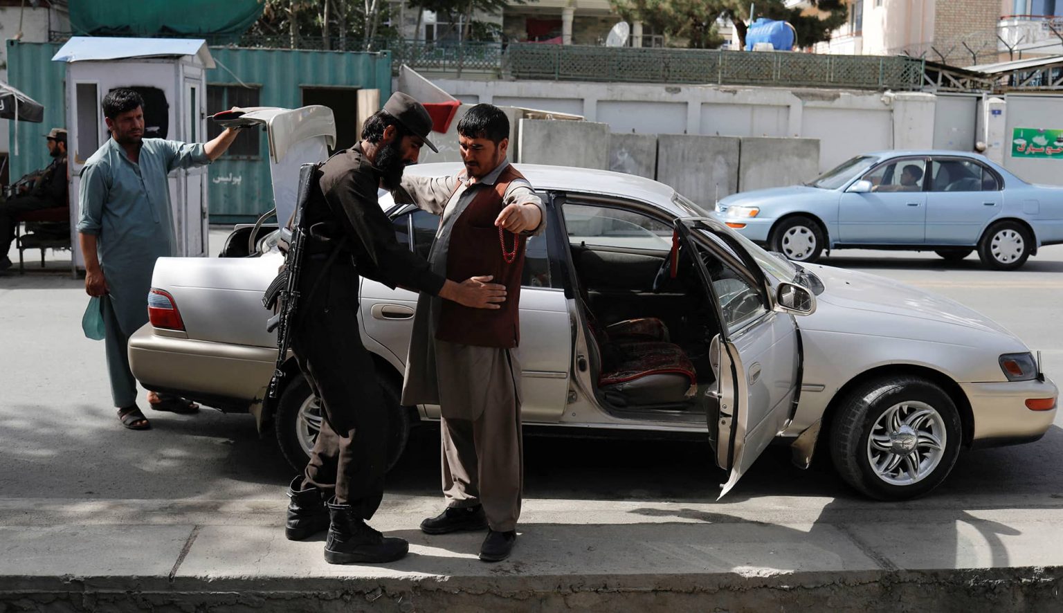 A Taliban soldier checks a man at a checkpoint in Kabul, July 6, 2023. Photo credit: REUTERS/Ali Khara